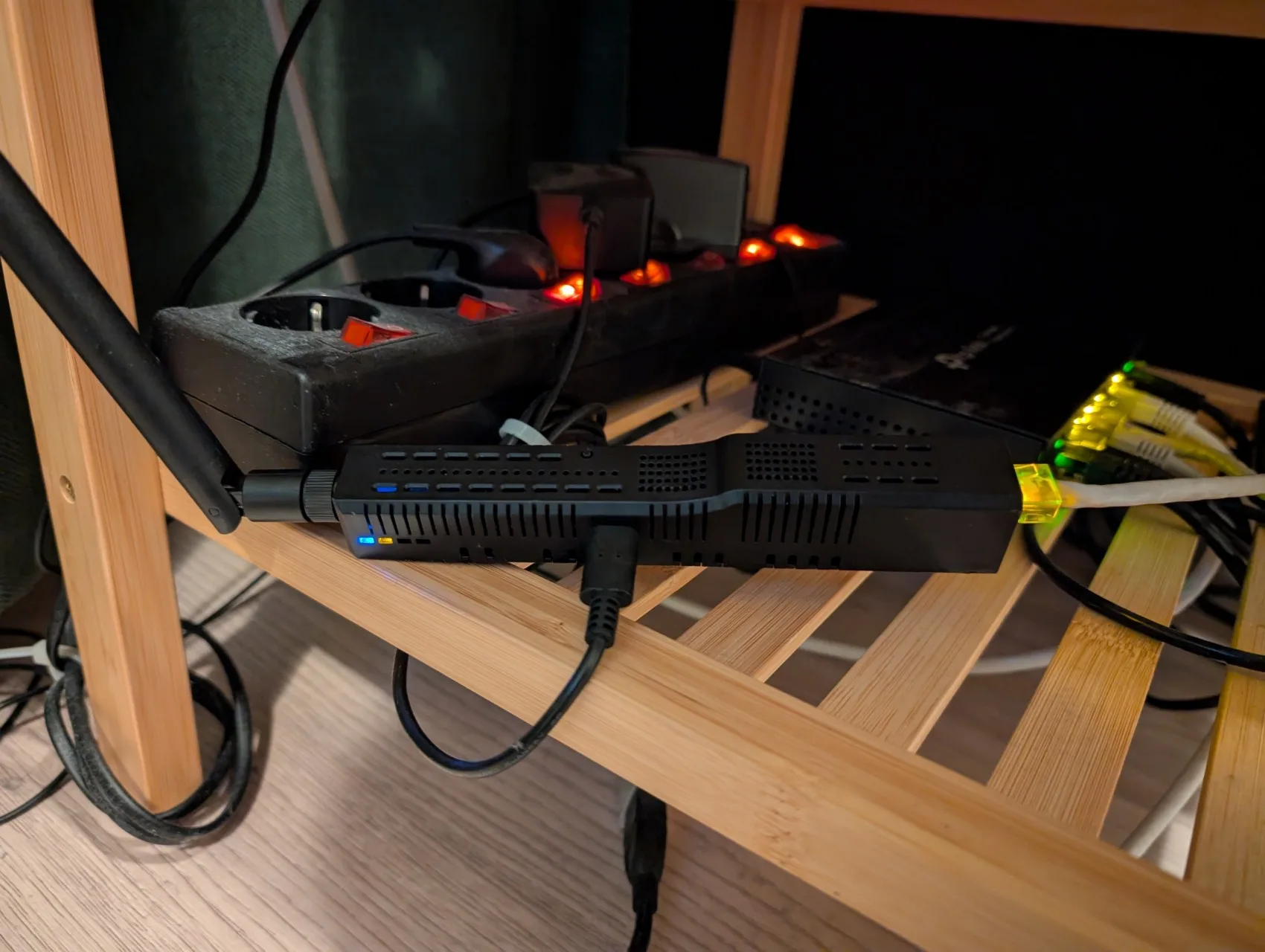 SMHUB on my nightstand next to a network switch and power strip